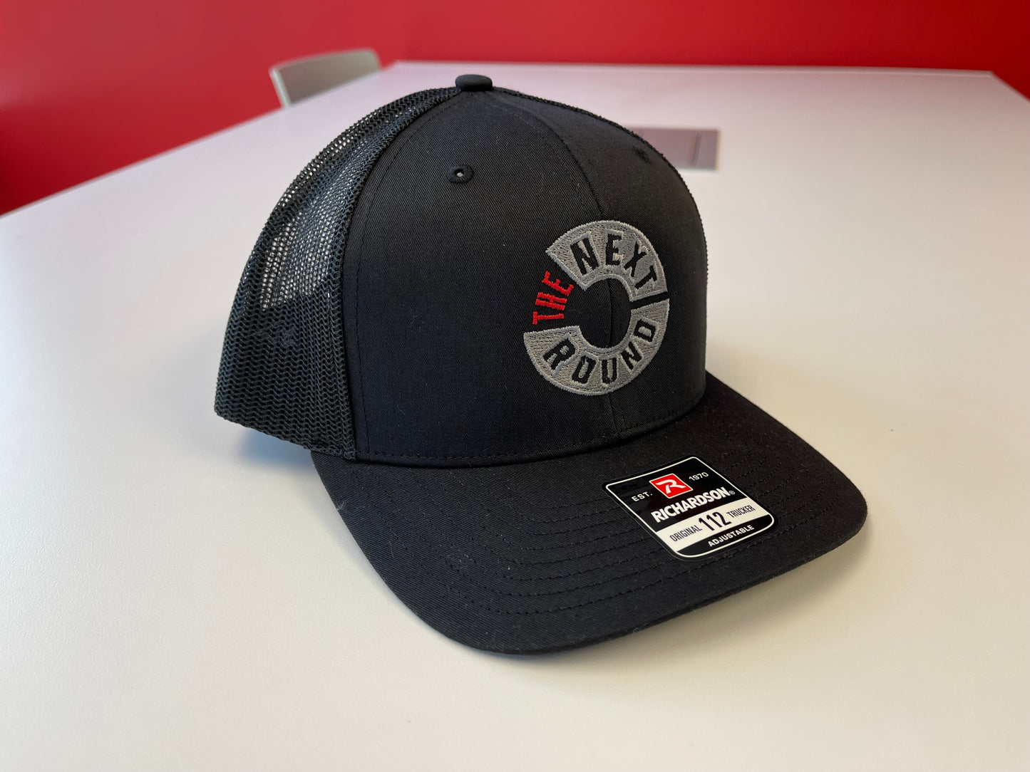 Next Round Logo Trucker Hat (Black)