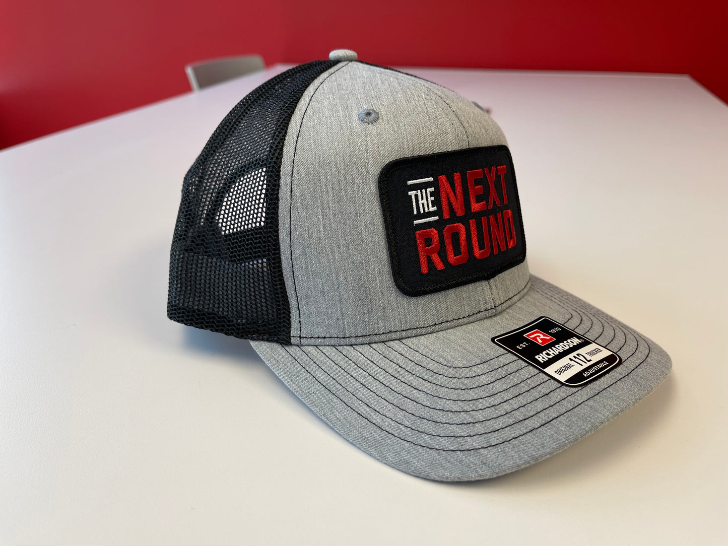 Next Round Patch Trucker Hat (Gray/Black)