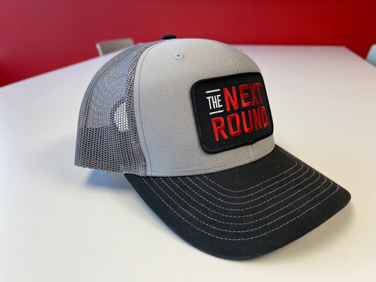 Next Round Patch Trucker Hat (Black/Gray)