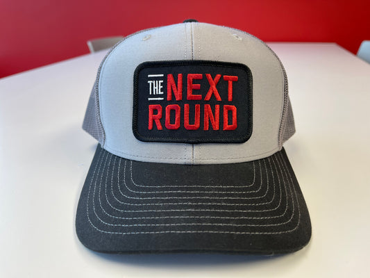 Next Round Patch Trucker Hat (Black/Gray)