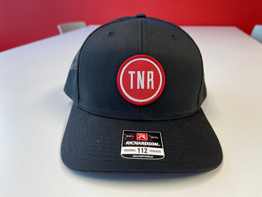 Next Round TNR Alternate Logo Trucker Hat (Black/Black)